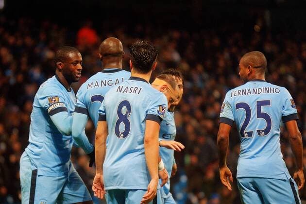 01.01.2015. Manchester, England. Barclays Premier League. Manchester City versus Sunderland. Manchester City midfielder Yaya Toure celebrates scoring his teams first goal (1-0) with Thundering shot xPaulxKeevilx  ActionPlus11585859