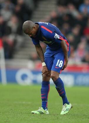 Ashley Young of Manchester United ManU pulls up and holds the back of his thigh - Barclays Premier League - Stoke City vs Manchester Utd - Stoke - England - 1st January 2015 - Picture Simon Bellis Sportimage EDITORIAL USE ONLY. No use with unauthorised audio, video, data, fixture lists, club league logos or live services. Online in-match use limited to 120 images, no video emulation. No use in betting, games or single club league player publications.
