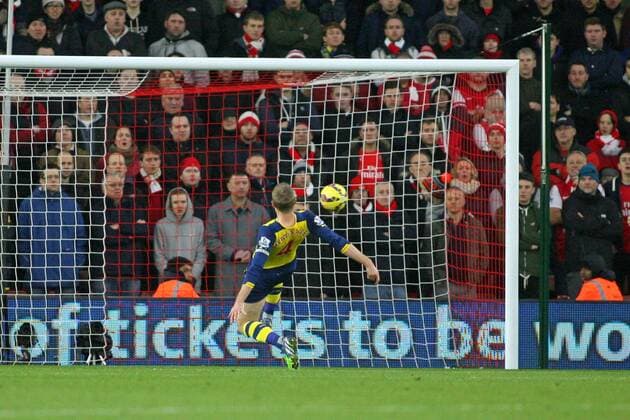 Football - 2014 2015 Premier League - Southampton vs. Arsenal Per Mertesacker of Arsenal fails to stop Southampton s Sadio Mane effort on goal to put Saints one nil up at St Mary s Stadium Southampton Colorsport Shaun Boggust 