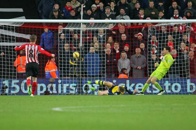 Football - 2014 2015 Premier League - Southampton vs. Arsenal Per Mertesacker of Arsenal fails to stop Southampton s Sadio Mane effort on goal to put Saints one nil up at St Mary s Stadium Southampton Colorsport Shaun Boggust 