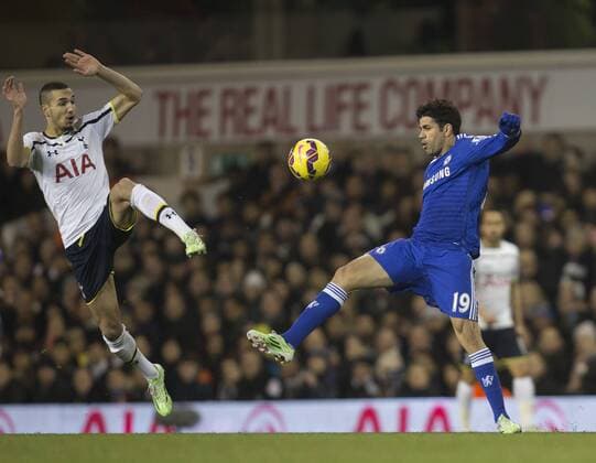 01.01.2015. London, England. Barclays Premier League. Tottenham versus Chelsea. Chelsea s Diego Costa goes up for the challenge with Tottenham Hotspur s Nabil Bentaleb (left) xNigelxCookex  ActionPlus11585907