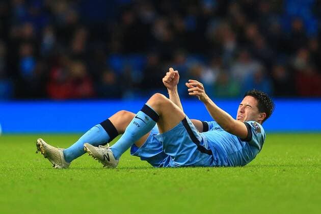 Samir Nasri of Manchester City struggles to sit up, in pain - Manchester City vs. Sunderland - Barclay s Premier League - Etihad Stadium - Manchester - 28 12 2014 Pic Philip Oldham Sportimage EDITORIAL USE ONLY. No use with unauthorised audio, video, data, fixture lists, club league logos or live services. Online in-match use limited to 120 images, no video emulation. No use in betting, games or single club league player publications.