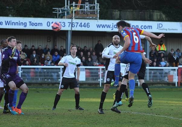 Football - 2014 2015 FA Cup - Third Round: Dover Athletic vs. Crystal Palace Palace s Scott Dann scores his 2nd goal pastAndrew Rafferty at the Crabble Athletic Ground. COLORSPORT ANDREW COWIE 