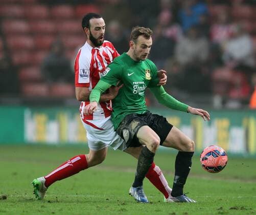 Marc Wilson of Stoke City tussles with Wes York of Wrexham - FA Cup Third Round - Stoke City vs Wrexham - Britannia Stadium - Stoke on Trent - England - 4th January 2015 - Picture Simon Bellis Sportimage EDITORIAL USE ONLY. No use with unauthorised audio, video, data, fixture lists, club league logos or live services. Online in-match use limited to 120 images, no video emulation. No use in betting, games or single club league player publications.