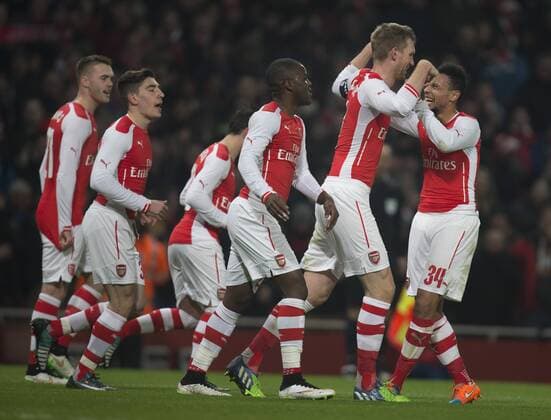 04.01.2015. London, England. FA Cup 3rd Round. Arsenal versus Hull. Arsenal players celebrate their opening goal scored by Per Mertesacker. xNigelxCookex  ActionPlus11586943