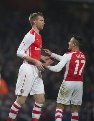 04.01.2015. London, England. FA Cup 3rd Round. Arsenal versus Hull. Arsenal s Per Mertesacker celebrates his goal with Alexis Sanchez. xNigelxCookex  ActionPlus20833396