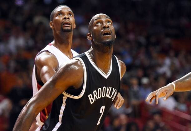 Jan. 4, 2015 - Miami, FL, USA - Miami Heat s Chris Bosh guards Brooklyn Nets Kevin Garnett during the first half on Sunday, Jan. 4, 2015, at AmericanAirlines Arena in Miami. Brooklyn Nets at Miami Heat - ZUMAm67_