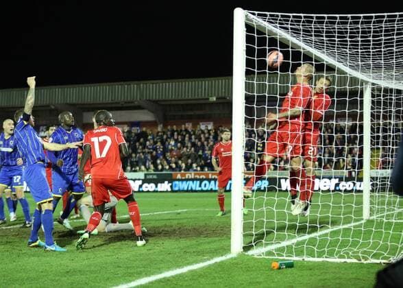 Aktuell Fußball, England, FA Cup, AFC Wimbledon - FC Liverpool Football - 2014 2015 FA Cup - Third Round: AFC Wimbledon - FC Liverpool, Liverpool s Martin Skrtel clears off the line before AFC Wimbledon s Adebayo Akinfenwa scores at The Cherry Red Records Stadium  WIM_LIV