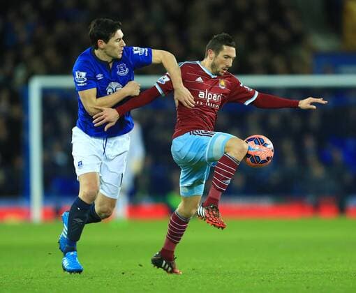 Gareth Barry of Everton battles West Ham s Morgan Amalfitano - Everton vs. West Ham United - FA Cup Third Round - Goodison Park - Liverpool - 06 01 2015 Pic Philip Oldham Sportimage EDITORIAL USE ONLY. No use with unauthorised audio, video, data, fixture lists, club league logos or live services. Online in-match use limited to 120 images, no video emulation. No use in betting, games or single club league player publications.
