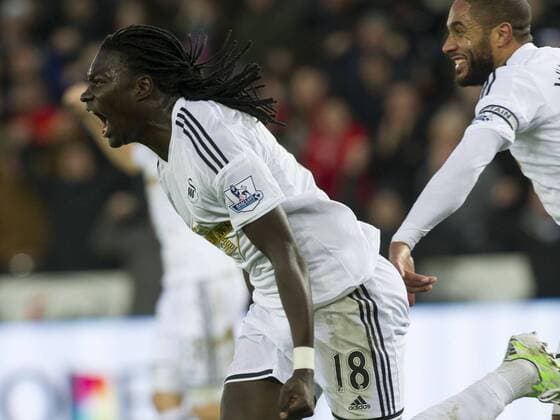 Aktuell Fußball, England, Premier League, Swansea City - West Ham United Football - 2014 2015 Premier League - Swansea City vs. West Ham United Bafétimbi Gomis of Swansea celebrates scoring at The Liberty Stadium. COLORSPORT WINSTON BYNORTH 