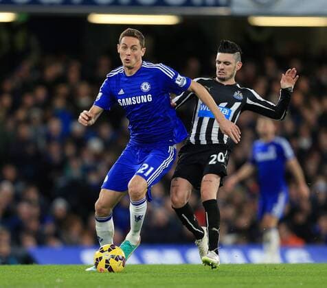Chelsea s Nemanja Matic tussles with Newcastle s Remy Cabella Premier League - Chelsea vs Newcastle United - Stamford Bridge - England - 10th January 2015 - Picture David Klein Sportimage EDITORIAL USE ONLY. No use with unauthorised audio, video, data, fixture lists, club league logos or live services. Online in-match use limited to 120 images, no video emulation. No use in betting, games or single club league player publications.