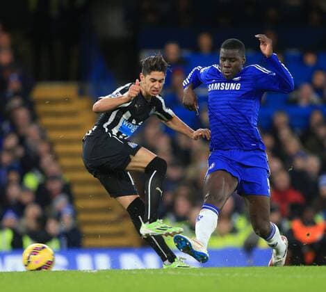 Chelsea s Kurt Zouma tussles with Newcastle s Ayoze Perez Premier League - Chelsea vs Newcastle United - Stamford Bridge - England - 10th January 2015 - Picture David Klein Sportimage EDITORIAL USE ONLY. No use with unauthorised audio, video, data, fixture lists, club league logos or live services. Online in-match use limited to 120 images, no video emulation. No use in betting, games or single club league player publications.