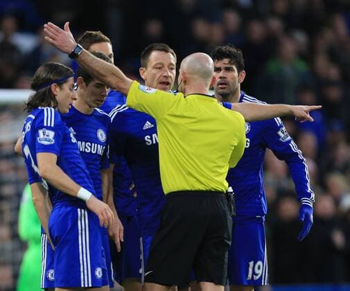 Chelsea s players argues with referee Roger East Premier League - Chelsea vs Newcastle United - Stamford Bridge - England - 10th January 2015 - Picture David Klein Sportimage EDITORIAL USE ONLY. No use with unauthorised audio, video, data, fixture lists, club league logos or live services. Online in-match use limited to 120 images, no video emulation. No use in betting, games or single club league player publications.
