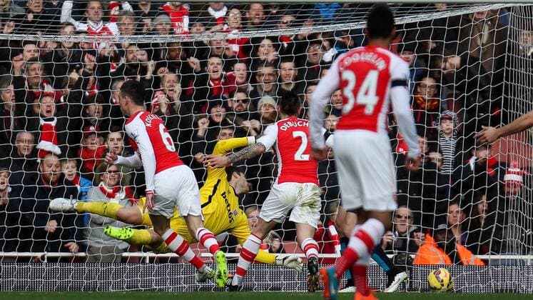 Football - 2014 2015 - Barclays Premier League, - Arsenal Vs Stoke City, Arsenal s Laurent Koscielny beats Stoke City s Asmir Begovic with a header to open the scoring at The Emirates Stadium COLORSPORT DANIEL BEARHAM  ARS_STO