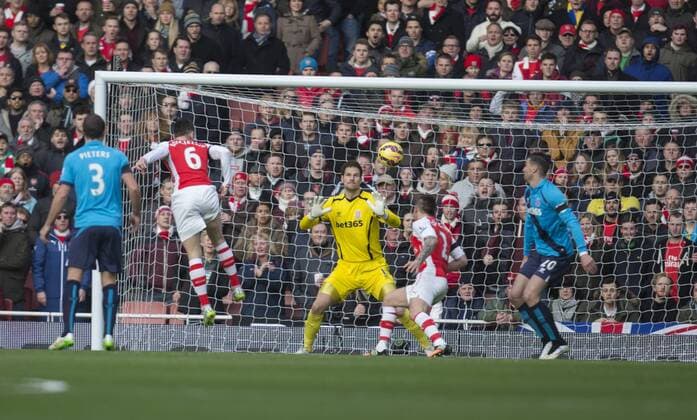 11.01.2015. London, England. Barclays Premier League. FC Arsenal versus Stoke City. Arsenal s Laurent Koscielny scores the opening goal. xNigelxCookex  ActionPlus11588467