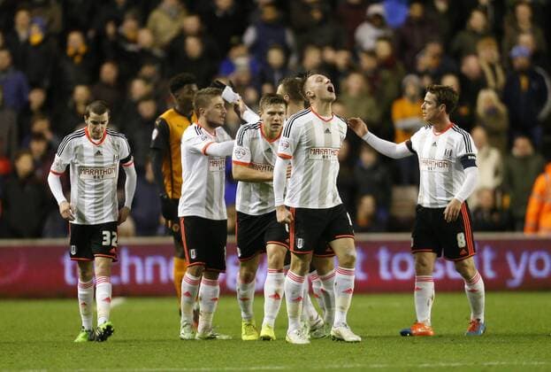 Cauley Woodrow (centre) celebrates scoring the opening goal of the game for Fulham- Football - FA Cup third round replay - Wolverhampton Wanderers - FC Fulham EDITORIAL USE ONLY. No use with unauthorised audio, video, data, fixture lists, club league logos or live services. Online in-match use limited to 120 images, no video emulation. No use in betting, games or single club league player publications.