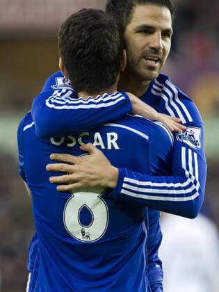 Football - 2014 2015 Premier League - Swansea City vs. Chelsea Oscar of Chelsea celebrates scoring with Nemanja Matic of Chelsea at The Liberty Stadium. COLORSPORT WINSTON BYNORTH 