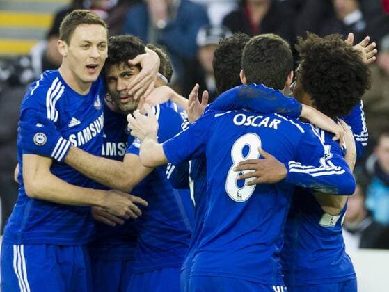 Football - 2014 2015 Premier League - Swansea City vs. Chelsea Diego Costa of Chelsea celebrates scoring their 2nd goal at The Liberty Stadium. COLORSPORT WINSTON BYNORTH 