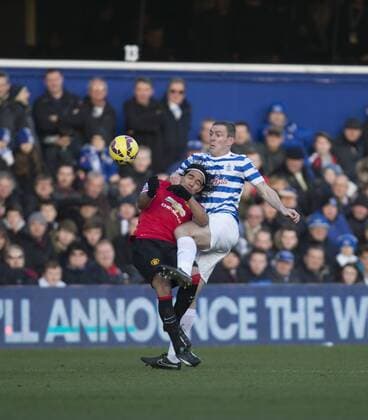 17.01.2015. London, England. Barclays Premier League. Queens Park Rangers versus Manchester United ManU QPR s Richard Dunne and Manchester United s Radamel Falcao battle for the ball. xNigelxCookex  ActionPlus11589951