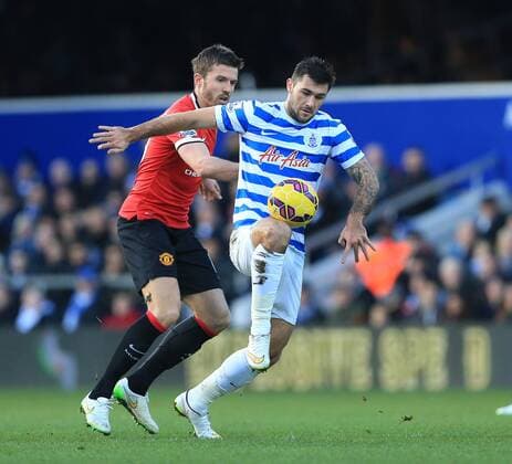 QPR s Charlie Austin tussles with Manchester United ManU s Michael Carrick Barclays Premier League - Queens Park Rangers vs Manchester United - Loftus Road - England - 17th January 2015 - Picture David Klein Sportimage EDITORIAL USE ONLY. No use with unauthorised audio, video, data, fixture lists, club league logos or live services. Online in-match use limited to 120 images, no video emulation. No use in betting, games or single club league player publications.