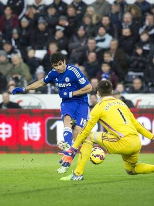 Football - 2014 2015 Premier League - Swansea City vs. Chelsea Diego Costa of Chelsea scoring their 3rd goal at The Liberty Stadium. COLORSPORT WINSTON BYNORTH 