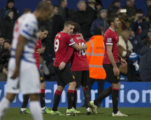 17.01.2015. London, England. Barclays Premier League. Queens Park Rangers versus Manchester United ManU Manchester United s James Wilson is congratulated by teammate Wayne Rooney after his goal which made it 2-0. xNigelxCookex  ActionPlus11590069