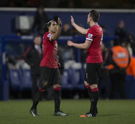 17.01.2015. London, England. Barclays Premier League. Queens Park Rangers versus Manchester United ManU Manchester United s Radamel Falcao Garc& xed;a gets a high five from team mate Phil Jones at the final whistle. xNigelxCookex  ActionPlus11590072