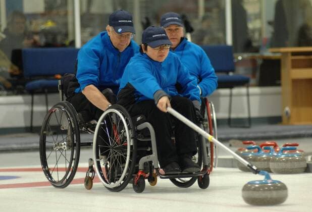 Paralympic gold medalist Darryl Neighbour (L) and Gary Cormack of Team Canada compete during the 2015 BC Wheelchair Curling Championship in Richmond, BC, Canada, Jan.17, 2015. A 3-day championship will see Canada s top curlers battle for the trophy. ) (SP)CANADA-RICHIMOND-CURLING SergeixBachlakov 
