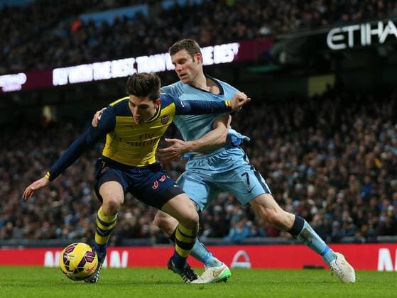 James Milner of Manchester City tussles with Hector Bellerin of Arsenal - Barclays Premier League - Manchester City vs Arsenal - Etihad Stadium - Manchester - England - 18th January 2015 - Picture Simon Bellis Sportimage EDITORIAL USE ONLY. No use with unauthorised audio, video, data, fixture lists, club league logos or live services. Online in-match use limited to 120 images, no video emulation. No use in betting, games or single club league player publications.