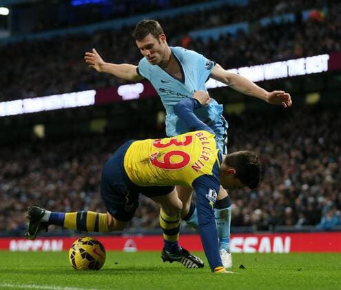 James Milner of Manchester City tussles with Hector Bellerin of Arsenal - Barclays Premier League - Manchester City vs Arsenal - Etihad Stadium - Manchester - England - 18th January 2015 - Picture Simon Bellis Sportimage EDITORIAL USE ONLY. No use with unauthorised audio, video, data, fixture lists, club league logos or live services. Online in-match use limited to 120 images, no video emulation. No use in betting, games or single club league player publications.