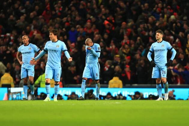 Manchester City are left dejected following Arsenal s second goal - Manchester City vs. Arsenal - Barclay s Premier League - Etihad Stadium - Manchester - 18 01 2015 Pic Philip Oldham Sportimage EDITORIAL USE ONLY. No use with unauthorised audio, video, data, fixture lists, club league logos or live services. Online in-match use limited to 120 images, no video emulation. No use in betting, games or single club league player publications.
