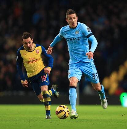 Arsenal s Santi Cazorla Stevan Jovetic of Manchester City - Manchester City vs. Arsenal - Barclay s Premier League - Etihad Stadium - Manchester - 18 01 2015 Pic Philip Oldham Sportimage EDITORIAL USE ONLY. No use with unauthorised audio, video, data, fixture lists, club league logos or live services. Online in-match use limited to 120 images, no video emulation. No use in betting, games or single club league player publications.