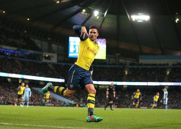 Olivier Giroud of Arsenal celebrates scoring his goal to make the score 0-2 - Barclays Premier League - Manchester City vs Arsenal - Etihad Stadium - Manchester - England - 18th January 2015 - Picture Simon Bellis Sportimage EDITORIAL USE ONLY. No use with unauthorised audio, video, data, fixture lists, club league logos or live services. Online in-match use limited to 120 images, no video emulation. No use in betting, games or single club league player publications.