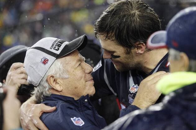 New England Patriots quarterback Tom Brady (12) hugs Patriots owner Robert Kraft after the team defeated the Indianapolis Colts 45-7 in AFC Championship Game at Gillette Stadium in Foxborough, Massachusetts on January 18, 2015. The Patriots will take on the Seattle Seahawks at Super Bowl XLIX in Glendale, Arizona on February 1, 2015.  BOS20150118137 MATTHEWxHEALEY
