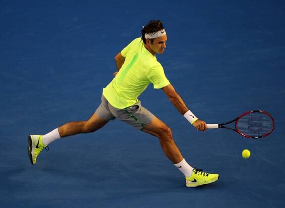 (150119) -- MELBOURNE, Jan. 19, 2015 -- Roger Federer of Switzerland returns the ball during the first round match of men s singles at the 2015 Australian Open tournament in Melbourne, Australia, Jan. 19, 2015. (SP)AUSTRALIA-MELBOURNE-TENNIS XuxYanyan 
