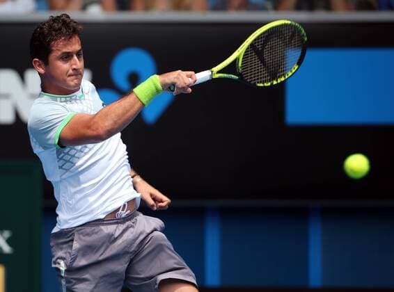 Nicolas Almagro of Spain returns the ball during the men s singles first round match at the 2015 Australian Open tennis tournament in Melbourne, Australia, Jan. 20, 2015. XuxYanyan 