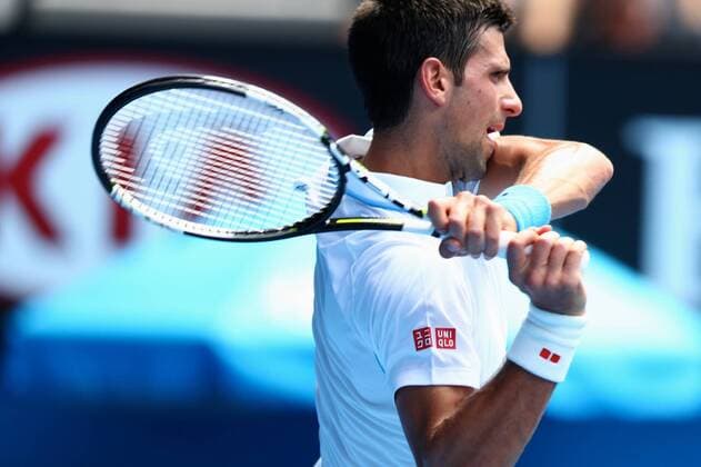 Novak Djokovic of Serbia returns a shot in their men s singles second round match of the 2015 Australian Open tennis tournament in Melbourne, Australia, 22 January 2015.  20150122_44094