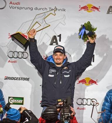 ALPINE SKIING - FIS WC Kitzbuehel KITZBUEHEL,AUSTRIA,23.JAN.15 - ALPINE SKIING - FIS World Cup, super giant slalom, men, award ceremony. Image shows the rejoicing of Dominik Paris (ITA). Keywords: trophy.