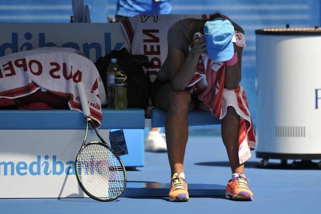 24.01.2015 Australian Open Tennis from Melbourne Park. Varvara Lepchenko of the USA rests feeling the heat during her match against Agnieszka Radwanska of Poland on day six of the 2015 Australian Open at Melbourne Park, Melbourne, Australia. xEssixLimx  ActionPlus11591796