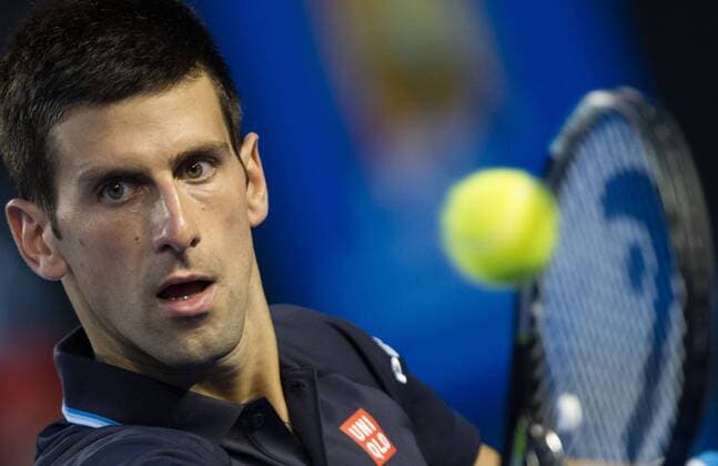 (150124) -- MELBOURNE, Jan. 24, 2015 -- Novak Djokovic of Serbia returns the ball during the men s singles third round match at the 2015 Australian Open tennis tournament at Melbourne Park in Melbourne, Australia, Jan. 24, 2015. (SP)AUSTRALIA-MELBOURNE-TENNIS-DJOKOVIC BaixXue 