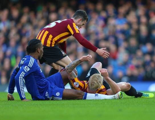 24.01.2015. London, England. FA Cup 4th Round. Chelsea versus Bradford City. Bradford City defender Andrew Davies (5) tackles Chelsea forward Didier Drogba (11) xChakirxDahmanix  ActionPlus11592042
