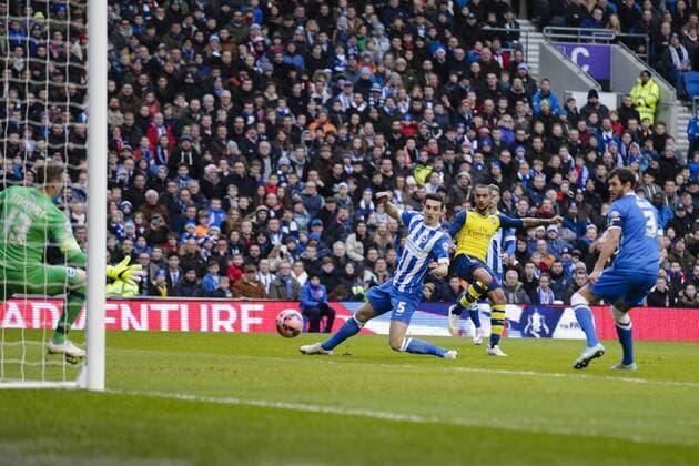 25.01.2015. Brighton, England. FA Cup 4th Round. Brighton versus Arsenal. Arsenal& x2019;s Theo Walcott scores the opening goal past Brighton &amp; Hove Albion s diving goalkeeper David Stockdale xCraigxMercerx  ActionPlus11592459