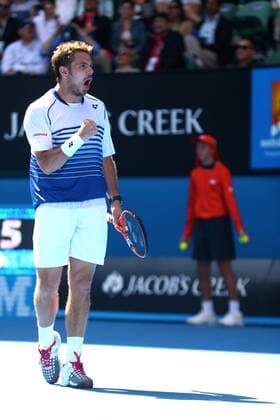 Stanislas Wawrinka of Switzerland reacts after scoring in their men s singles quarterfinal match of the 2015 Australian Open tennis tournament in Melbourne, Victoria, Australia, 28 January 2015.  20150128_28359