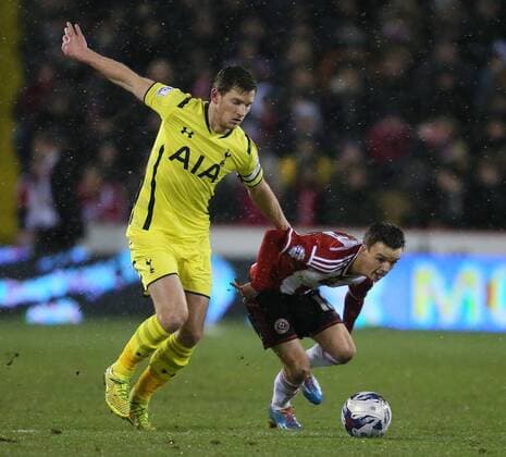 Jan Vertonghen of Tottenham tussles with Stefan Scougall of Sheffield Utd - League Cup Semi Final Second Leg - Sheffield Utd vs Tottenham - Bramall Lane Stadium - Sheffield - England - 28th January 2015 - Picture Simon Bellis Sportimage EDITORIAL USE ONLY. No use with unauthorised audio, video, data, fixture lists, club league logos or live services. Online in-match use limited to 120 images, no video emulation. No use in betting, games or single club league player publications.