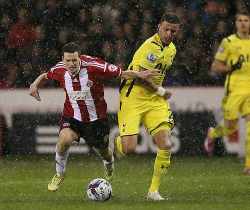Jamie Murphy of Sheffield Utd tussles with Kyle Walker of Tottenham in the snow - League Cup Semi Final Second Leg - Sheffield Utd vs Tottenham - Bramall Lane Stadium - Sheffield - England - 28th January 2015 - Picture Simon Bellis Sportimage EDITORIAL USE ONLY. No use with unauthorised audio, video, data, fixture lists, club league logos or live services. Online in-match use limited to 120 images, no video emulation. No use in betting, games or single club league player publications.