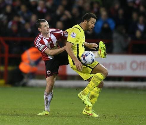 Michael Doyle of Sheffield Utd tackles Mousa Dembele of Tottenham - League Cup Semi Final Second Leg - Sheffield Utd vs Tottenham - Bramall Lane Stadium - Sheffield - England - 28th January 2015 - Picture Simon Bellis Sportimage EDITORIAL USE ONLY. No use with unauthorised audio, video, data, fixture lists, club league logos or live services. Online in-match use limited to 120 images, no video emulation. No use in betting, games or single club league player publications.