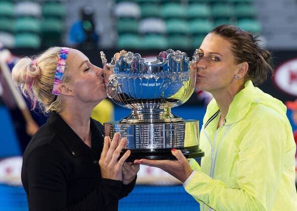 Bethanie Mattek-Sands (L) of the U.S. and Lucie Safarova of the Czech Republic kiss their trophy after winning their women s doubles final at the 2015 Australian Open tennis tournament at Melbourne Park in Melbourne, Australia, Jan. 30, 2015. (SP)AUSTRALIA-MELBOURNE-TENNIS-AUSTRALIA OPEN-WOMEN S DOUBLES FINAL BaixXue 