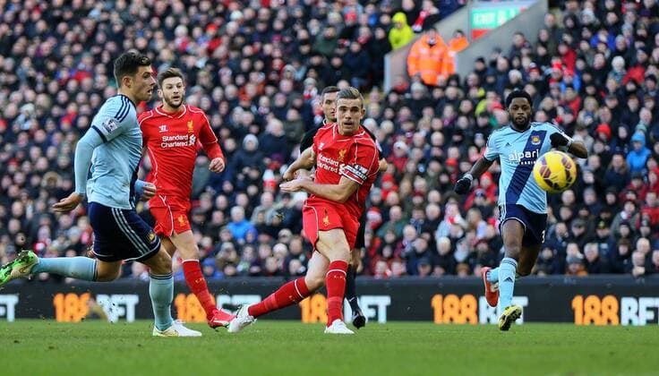 Captain for the day Jordan Henderson of FC Liverpool takes a shot on goal - Barclays Premier League - FC Liverpool vs West Ham United - Anfield Stadium - Liverpool - England - 31st January 2015 - EDITORIAL USE ONLY. No use with unauthorised audio, video, data, fixture lists, club league logos or live services. Online in-match use limited to 120 images, no video emulation. No use in betting, games or single club league player publications.