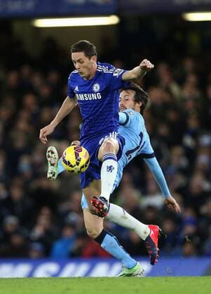 Chelsea s Nemanja Matic tussles with Manchester City s David Silva Barclays Premier League - Chelsea FC London - Manchester City - Stamford Bridge - England - 31st January 2015 - EDITORIAL USE ONLY. No use with unauthorised audio, video, data, fixture lists, club league logos or live services. Online in-match use limited to 120 images, no video emulation. No use in betting, games or single club league player publications.