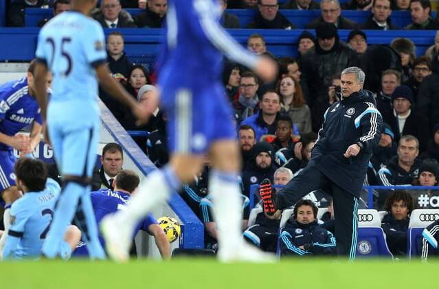 Chelsea s Jose Mourinho kicks the ball back onto the pitch hitting Manchester City s James Milner Barclays Premier League - Chelsea FC London - Manchester City - Stamford Bridge - England - 31st January 2015 - EDITORIAL USE ONLY. No use with unauthorised audio, video, data, fixture lists, club league logos or live services. Online in-match use limited to 120 images, no video emulation. No use in betting, games or single club league player publications.